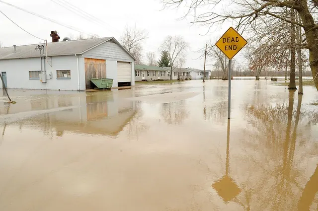 Floodwater surrounding homes in a coastal neighborhood